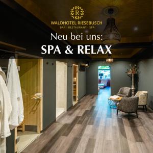 a lobby with a sign that reads new belt units spa and relax at Waldhotel Riesebusch in Bad Schwartau