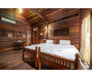 Giường trong phòng chung tại Mac Garden Resort