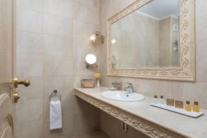 a bathroom with a sink and a mirror at Hotel & SPA Diamant Residence - All Inclusive in Sunny Beach