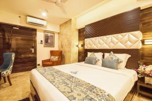 Tempat tidur dalam kamar di Hotel Auris & Banquets, Mumbai International Airport