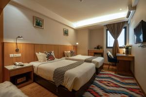 Krevet ili kreveti u jedinici u objektu Summer Tree Hotel Penang