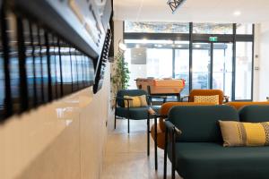 Khu vực ghế ngồi tại ibis Styles Nancy Centre Gare