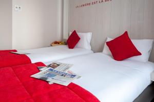 Una cama o camas en una habitación de Hôtel le 209 Paris Bercy