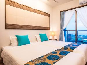 Gulta vai gultas numurā naktsmītnē Yukurina Resort Okinawa