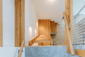 a staircase in a house with wooden cabinets at Village Turmzimmer in Kehl am Rhein