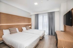 Posteľ alebo postele v izbe v ubytovaní Hotel Ciudad De Ávila