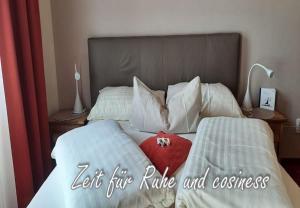 Llit o llits en una habitació de B&B Hotel das onkel fritz