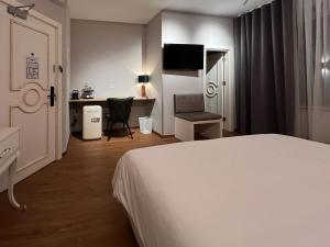 เตียงในห้องที่ The Kepos Hotel Erlangen