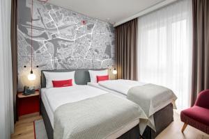 Gulta vai gultas numurā naktsmītnē IntercityHotel Dortmund