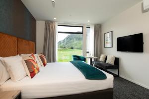 Телевизор и/или развлекательный центр в Quest Queenstown Apartments Remarkables Park