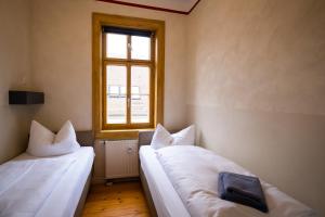 Postelja oz. postelje v sobi nastanitve "goethezimmer" Ferienwohnungen Am Schloss