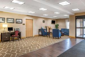 a waiting room at a hospital with a desk and chairs at Comfort Inn Downtown - University Area in Kalamazoo