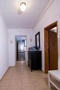 a hallway with a door and a counter in a room at Summer House by the Sea in Chorefto