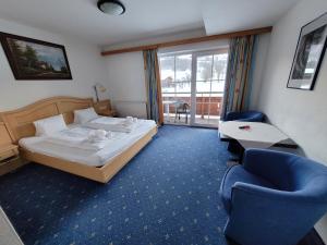 Ferienhotel Alpenhof में एक कमरे में एक या कई बेड