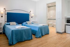 A bed or beds in a room at Le Dune Sicily Hotel