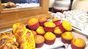 a bunch of muffins and other pastries on a table at Country Plaza in Guadalajara