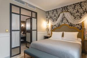 Tempat tidur dalam kamar di Hotel Gravina 51