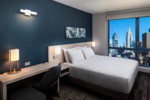 Ένα ή περισσότερα κρεβάτια σε δωμάτιο στο Hyatt Place New York Chelsea