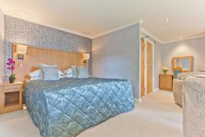 A bed or beds in a room at Ambleside Salutation Hotel & Spa, World Hotel Distinctive