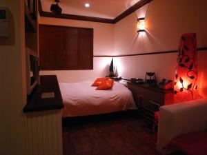 Posteľ alebo postele v izbe v ubytovaní HOTEL CHECK INN BALI adult only