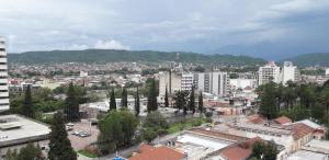 a view of a city with buildings and trees at Departamento Torre Murguía in San Salvador de Jujuy