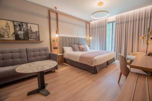 Voodi või voodid majutusasutuse Hotel Giralda Center toas