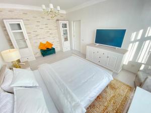 Giường trong phòng chung tại DeLight Apartments