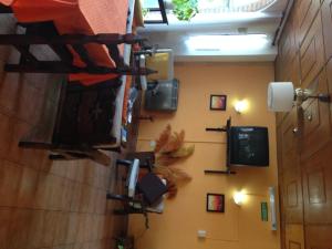 a room with a wall with a tv and a wall at Hotel Mediterraneo in Villa Carlos Paz