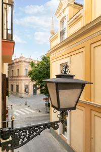 a street light on the side of a building at Holiday Rentals Tempa Museo in Seville