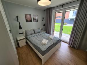 En eller flere senger på et rom på Apartament Mickiewicza