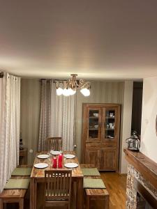 a dining room with a wooden table and chairs at Remarkable home Bohinj Lake in Bohinj