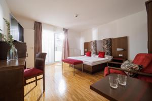 Krevet ili kreveti u jedinici u okviru objekta Hotel Garni Toscanina - Adults Only