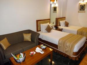 Posteľ alebo postele v izbe v ubytovaní Regency Madurai by GRT Hotels