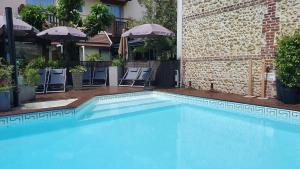 The swimming pool at or close to Suite Appart'Hôtel La Loggia By M Spa