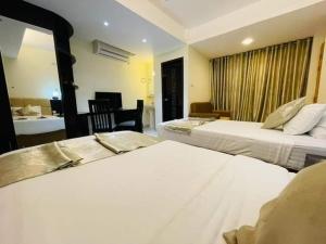 Katil atau katil-katil dalam bilik di White Park Boutique Hotel