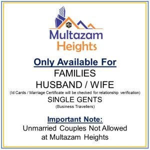 um sinal que lê mulikenham heights apenas disponível para famílias marido em Multazam Heights, DHA Phase 8 - 3 Bedrooms Luxury Apartments em Lahore