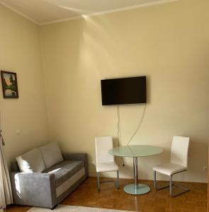 Μια τηλεόραση ή/και κέντρο ψυχαγωγίας στο Apartment 19 Vila Golf Nice Vacation