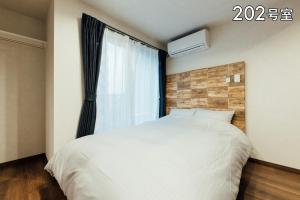 Lova arba lovos apgyvendinimo įstaigoje YOUR ROOM 熊本駅