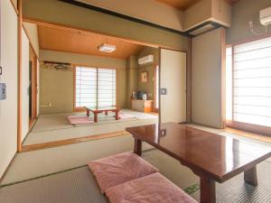 เตียงในห้องที่ Sakura Ryokan Asakusa Iriya