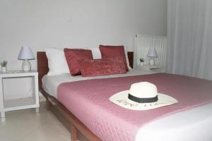 A bed or beds in a room at Moschoula Villa - Sea View Grand Apartment