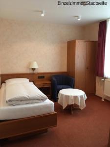 Кровать или кровати в номере Hotel Meeresburg