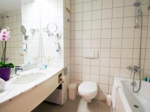 Kylpyhuone majoituspaikassa Arion Cityhotel Vienna und Appartements