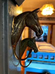 a statue of two horses on a wall at The House a la Cluj in Cluj-Napoca