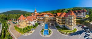 an aerial view of a large building with turrets at St Lukas Medical & SPA in Świeradów-Zdrój