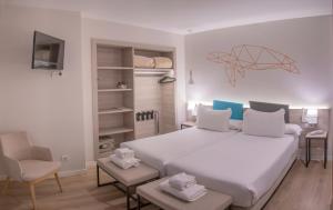 מיטה או מיטות בחדר ב-Hotel Mediterraneo Valencia