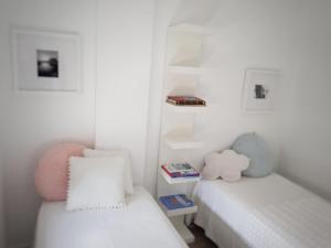 A bed or beds in a room at Foz Relógio Apartment