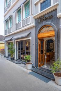 a store front of a building with a wooden door at O Pierre in Panaji