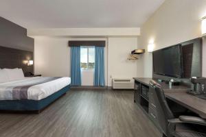 Ένα ή περισσότερα κρεβάτια σε δωμάτιο στο Comfort Hotel