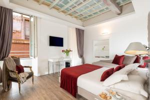 A bed or beds in a room at Hotel Navona