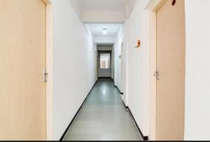 an empty corridor of an empty hospital hallway at Hotel Rahi in Nashik